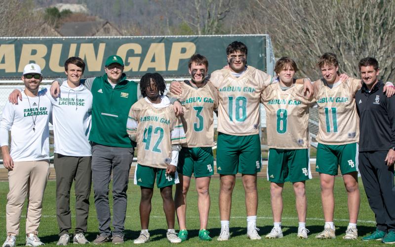 Wade Cheek/The Clayton Tribune. RGNS across head coach Ryne Linsley and the RGNS coaching staff stands with the Class of 2024 during Senior Night on Friday, April 5. The lacrosse Class of 2024 includes Huseyin Simsir, Danny Beccan, Will Brien, Cael Woody and Jack Moores.