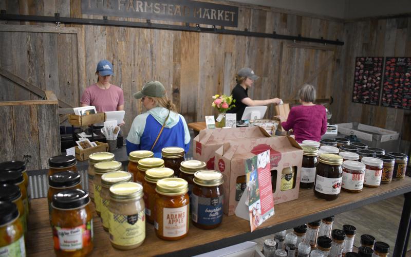 Enoch Autry/The Clayton Tribune. McCalister Russell and Erica Russell work at The Farmstead Market on East Savannah Street in Clayton. The Russells have multiple farms that provide the new business with beef, pork and dairy. The business opened earlier this month and will have a grand opening in June.