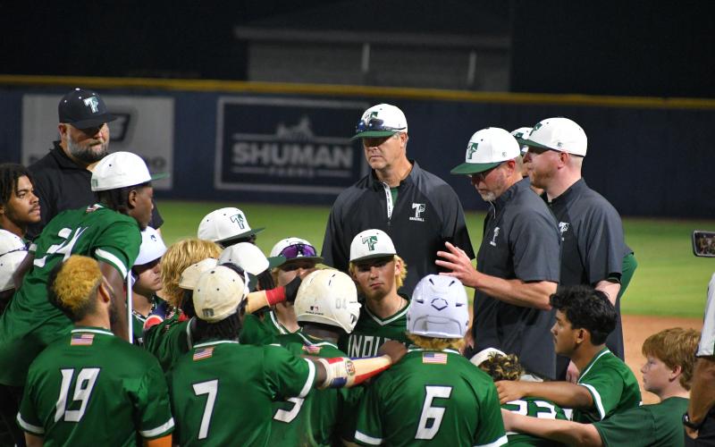 Wade Cheek/The Clayton Tribune. TFS baseball head coach Justin Pollock speaks to his players after they fell short in the Class A D-I state title against Prince Avenue. The Indians finished the year 28-12 and as the second-best team in the classification.
