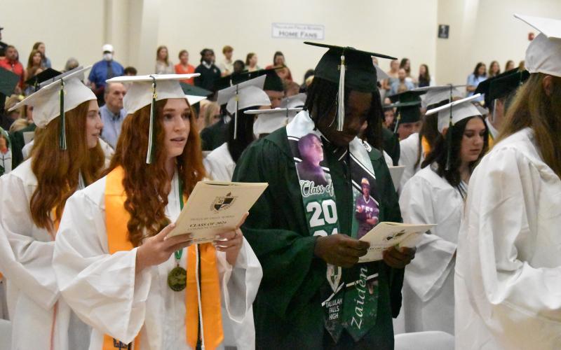 Matthew Osborne/CNI News Service. Tallulah Falls School seniors Jenna Chesser and Zaiden Cox join their Class of 2024 in singing during the May 24 morning commencement at the school.