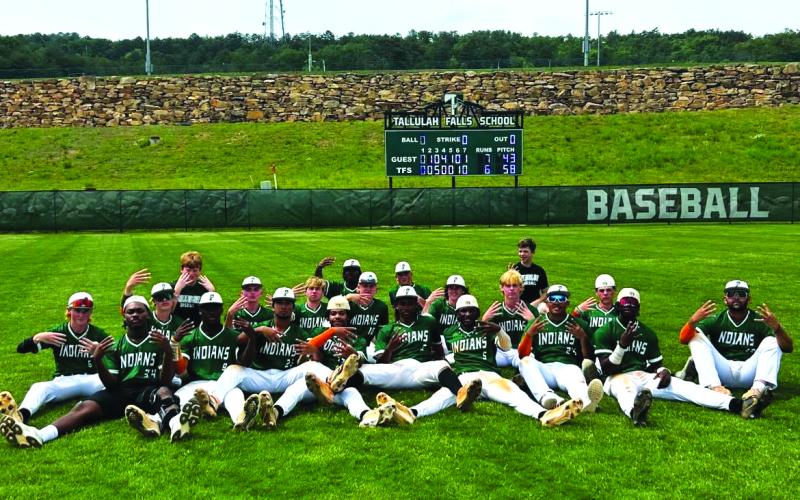 TFS baseball. TFS baseball players pose together as they each put four fingers up in honor of making the Final Four and for their former teammate, who passed away in November 2023. The Indians will now play King’s Ridge in the semifinal round.