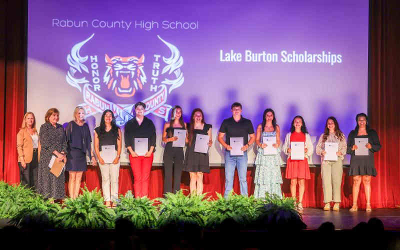 Photo courtesy Melissa Elzey. LBCA Foundation Scholarship Chair Diane White (from left), Scholarship Committee Member Frankie Singer, and LBCA President Elizabeth Gill stand with LBCAF scholarship award recipients at the Rabun County High School program.