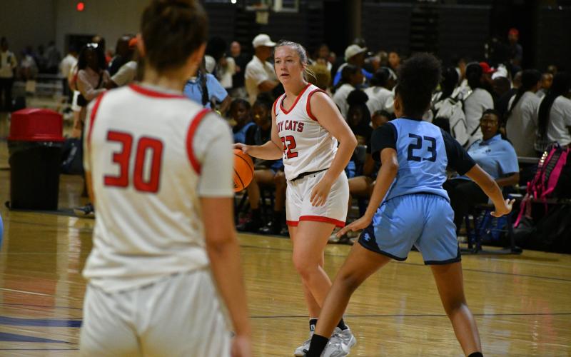 Wade Cheek/The Clayton Tribune. RCHS senior Chloe Erlewine surveys the floor for an open pass during the RCHS girls basketball team’s game against Lovejoy on June 14.