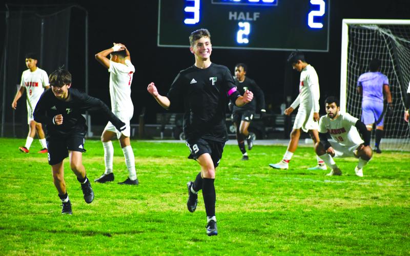 Wade Cheek/The Clayton Tribune. Austin Ball, a first-team all-state member, celebrates after scoring a goal in the 2023-2024 season.