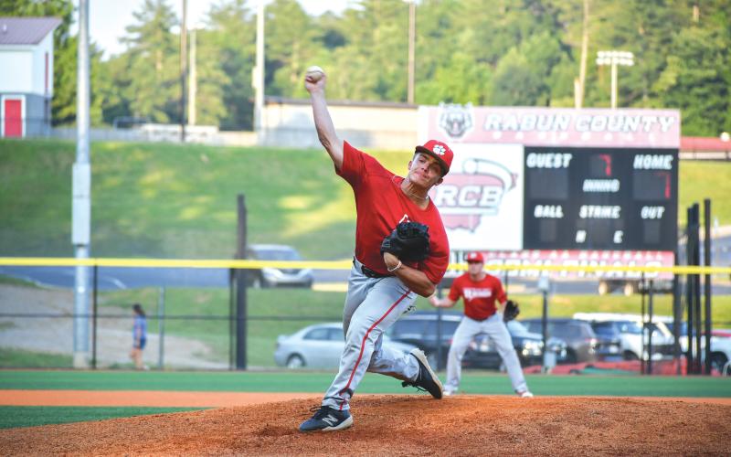 Wade Cheek/The Clayton Tribune. Wildcat newcomer Lake Evans extends off the mound to deliver a pitch on Thursday, June 13, when the RCHS baseball team took down East Jackson 7-2 in a summer ball game.