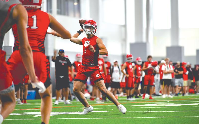 Wade Cheek/The Clayton Tribune. Rabun County football quarterback Ty Truelove completes a touchdown pass during a 7-on-7 game versus Hewitt-Trussville (Ala.) on Thursday, June 23, at the University of Georgia.