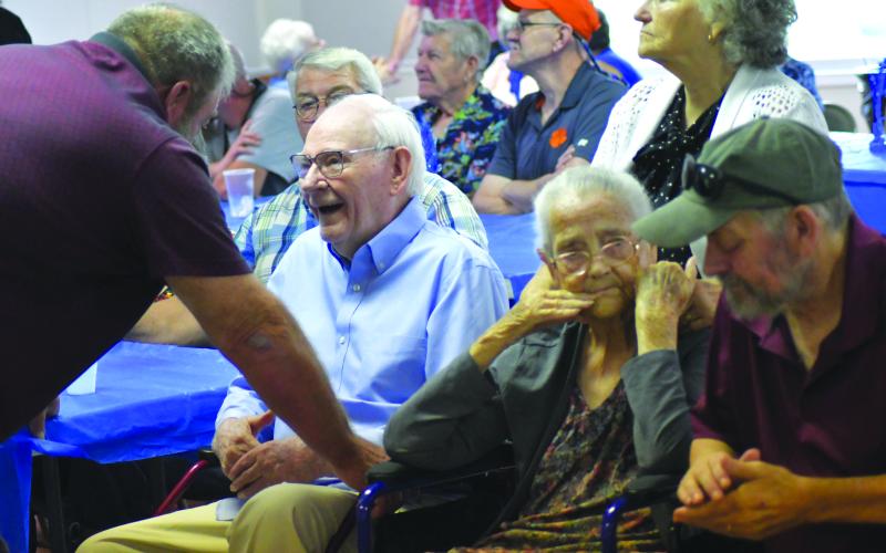 Enoch Autry/The Clayton Tribune. Ronnie Dailey talks with Chastain, while Ricky Chastain spends time with his grandmother Rose Chastain. Also pictured are Eddie Bingham, Jerry and Danny Gragg, and Pat.