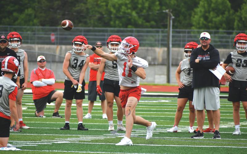 Wade Cheek/The Clayton Tribune. RCHS junior starting quarterback Ty Truelove lets it loose during a 7-on-7 practice with Hart County on June 6. Truelove underwent surgery in December after a torn labrum during the 2023 season.