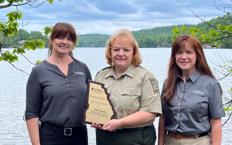 Submitted. Pictured are Michelle Egan, with the DNR Region, Amy Speed, administrative assistant at Moccasin Creek State Park, and Angie Johnson, Georgia State Parks Director. Speed recently won a statewide Customer Service Award from the Georgia Department of Natural Resources (DNR).