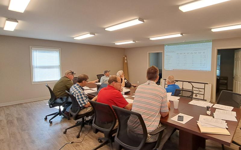 Megan Horn/The Clayton Tribune. RCWSA members review the FY 2025 budget before voting to approve it at the June 11 regular meeting. The water system and wastewater system total budget is $5,646,604.