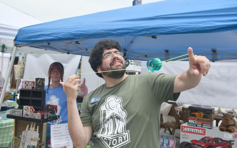 Wade Cheek/The Clayton Tribune. Gabriel Lopez of Blue Ridge Toys spins a yo-yo with ease as he shows off impressive tricks at Ramshackle that was held in downtown Clayton on Saturday, June 1.