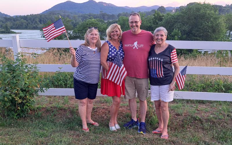 Megan Horn/The Clayton Tribune. Charlie Menedez, left, Laura Seberg, Jim Wilkes, and Gitta Shackelford enjoy Independence Day festivities at The Dillard House July 4.