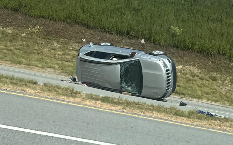 Katie Hamby/The Clayton Tribune. A crash involving two Jeeps at the intersection of Ga. 15 and Stekoa Falls Road just outside of Clayton city limits June 21 resulted in serious injuries. Pictured is the silver 2014 Jeep Compass Sport involved, which overturned and came to an uncontrolled rest on its passenger side facing southbound.