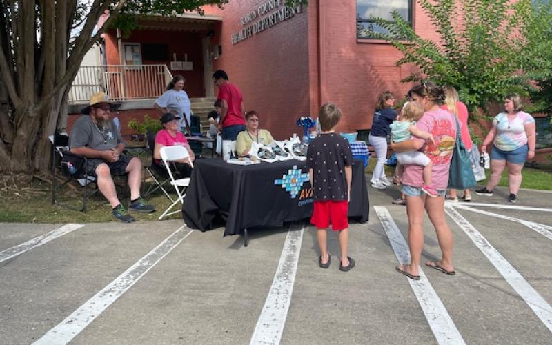 Submitted photo. Community members learn about Avita Community Partners as well as other area organizations during the July 16 health department event.