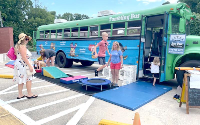 Submitted photo. Kids enjoyed the Blue Ridge Activity and Tumbling Center bus during the July 16 health department event.