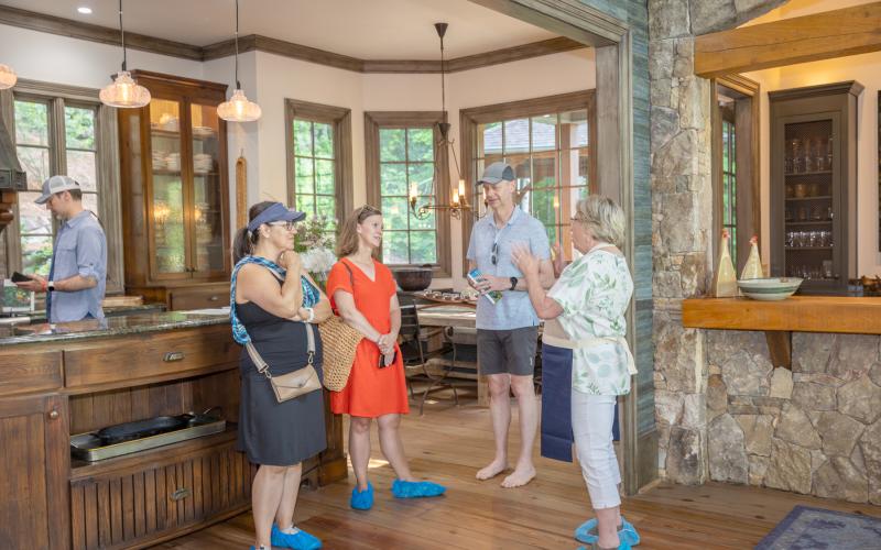 Photo courtesy of Melissa Elzey. In each home, volunteers welcomed visitors and shared details about the property during the Lake Burton Tour of Homes on June 22.