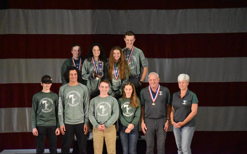 Wade Cheek/The Clayton Tribune. TFS marksmen stand with their medals after winning a national championship at this year’s CMP 3P Precision Air Rifle National Championship at Camp Perry in Ohio.