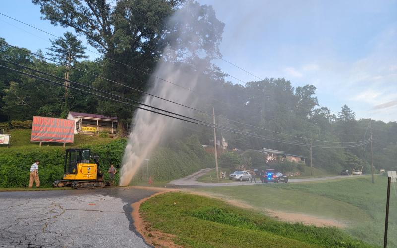 Enoch Autry/The Clayton Tribune. RCWSA personnel work to restore service following a water leak at Falcon Street near Highway 441 and Highway 76 East on the evening of  Saturday, July 20. Officials reported the water leak was caused by a failed pipe.