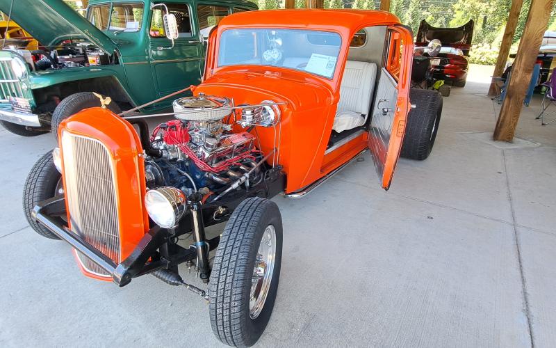 Megan Horn/The Clayton Tribune. This orange 1933 Plymouth with a 289 engine is owned by Doug Payne and was featured at last weekend’s Rockin’ Mountain Motor Show.
