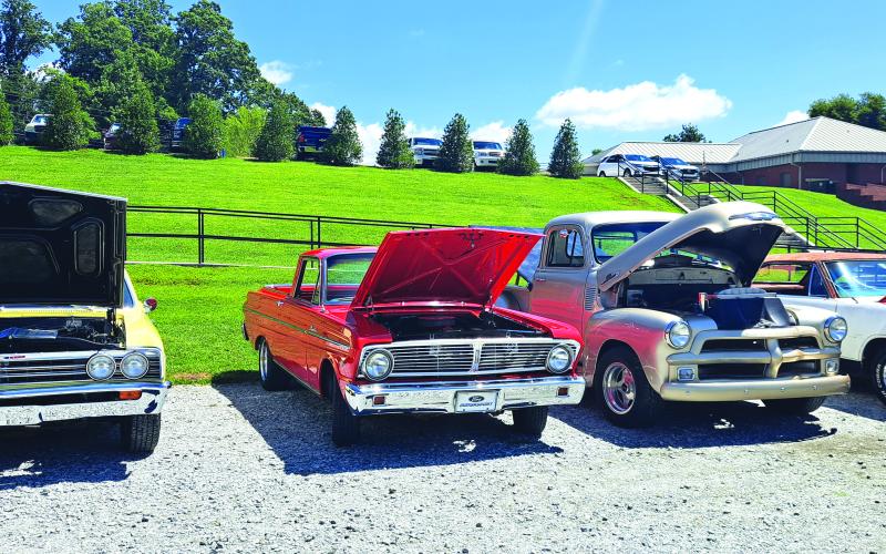 Megan Horn/The Clayton Tribune. Last weekend’s Pharoah’s Car Club Rockin’ Mountain Motor Show featured a variety of unique and classic cars such as these. The hoods were up to show event-goers the power underneath.
