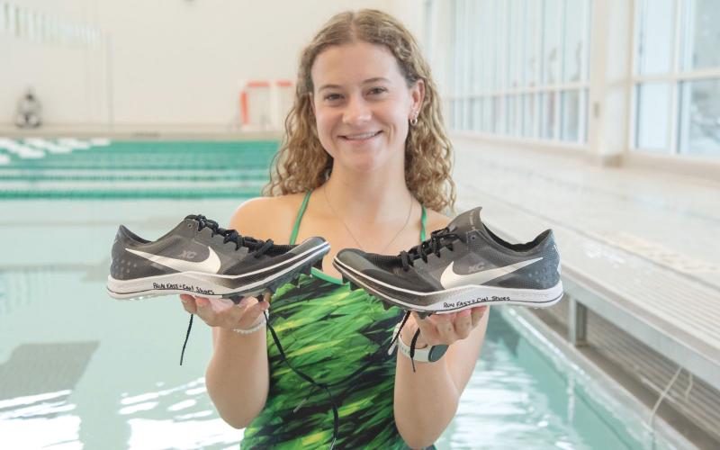 TFS Athletics. Carsyn Griffis, a junior at Tallulah Falls School, competes for the girls cross country and swim teams. Her brother, Caleb, passed away in 2021 and Griffis writes “Run Fast = Cool Shoes,” which is a quote from her late brother.