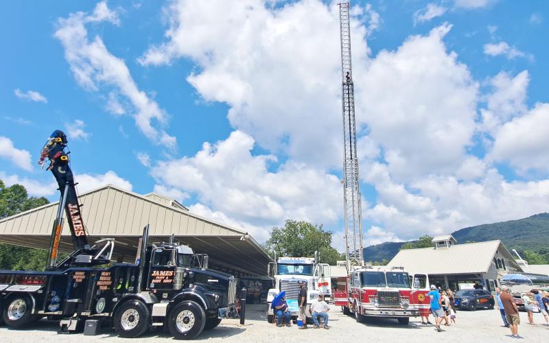Megan Horn/The Clayton Tribune. Many community heroes supported the Habitat for Humanity of Rabun County Touch-A-Truck event in Clayton last weekend and kids got the opportunity to explore various vehicles such as fire trucks, tow trucks, and many others. Below: James Reddy, 4, and Jones Reddy, 2, enjoy their time climbing into the driver’s seat of this 1960 Fiat Multipla presented by Capital City Home Loans at the Habitat for Humanity Touch-A-Truck event.