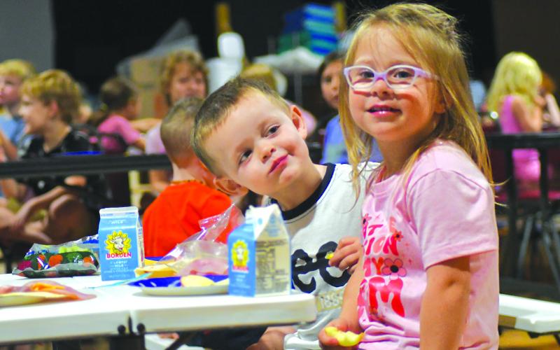 Enoch Autry/The Clayton Tribune. Gatlin Owens looks at his friend Audi Kilby during a day last week at the Mountain City Playhouse.