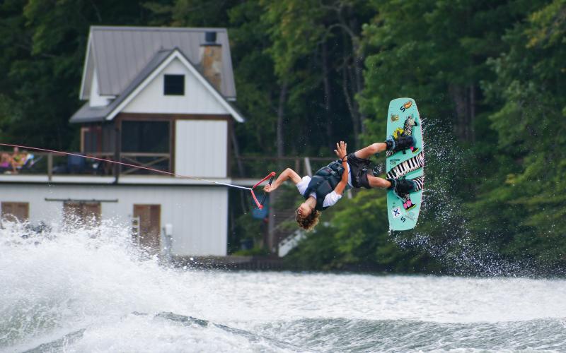 Wade Cheek/The Clayton Tribune. Bowen Glas shreds through the air upside down as part of his run that won him first-place in the intermediate division at the 24th-annual Mountain Air Classes on Saturday, Aug. 3.