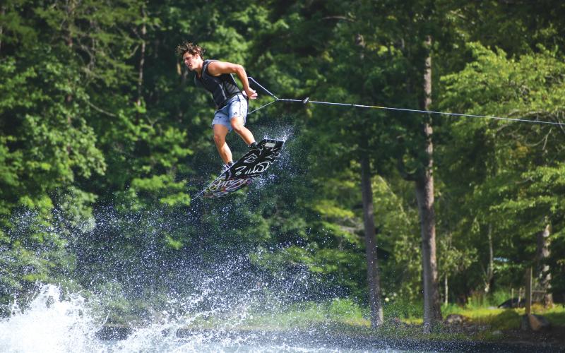 Wade Cheek/The Clayton Tribune. Jackson Clifford nails a 360-spin during the Mountain Air Classic on Saturday, Aug. 3. Clifford competed in the talented outlaw division that was filled with wakeboarder who compete nationally.