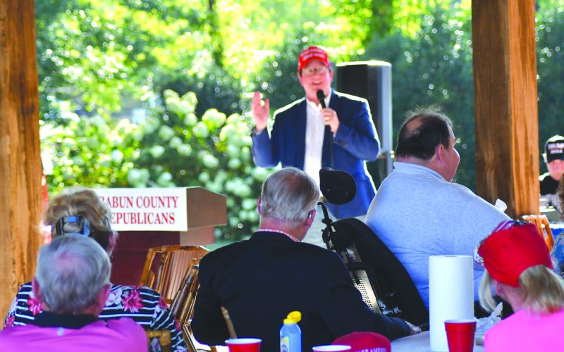 Enoch Autry/The Clayton Tribune. Georgia Republican Party Chairman Josh McKoon address those seated outside at the pavillion.