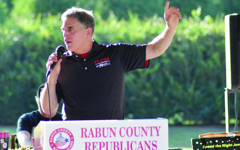 Enoch Autry/The Clayton Tribune. U.S. Congressman Andrew Clyde talks to the crowd after the audience ate sausage, potatoes, corn on the cobb, and shrimp.