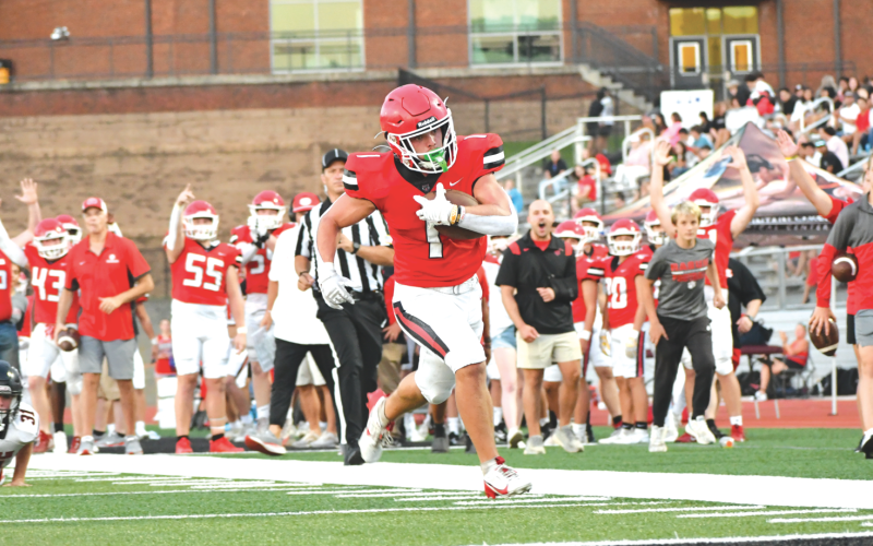 Wade Cheek/The Clayton Tribune. Rabun County running back Lake Evans takes it down the home sideline for a touchdown against Franklin (N.C.) during the Aug. 9 jamboree. With their varsity players in the game, the Wildcats held a 35-7 advantage going into halftime. RCHS plays at White County on Aug. 16.