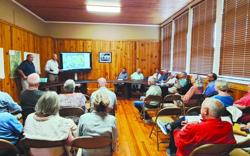 Megan Horn/The Clayton Tribune. The Dillard City Hall council meeting had a roomful attendance as citizens listened to David Marvin and Bryan Bullock discuss plans for the $52 million capital investment project, Dillard House Farm Resort.