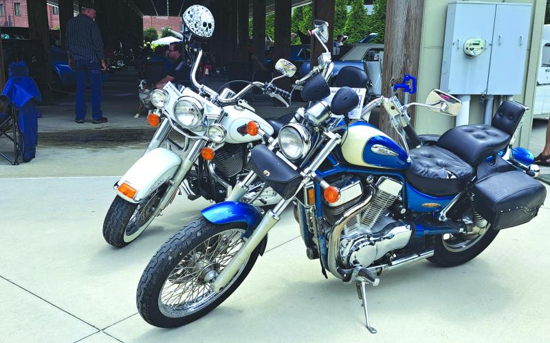 Megan Horn/The Clayton Tribune. A few motorcycles were featured in last Saturday’s Rockin’ Mountain Motor Show. Pictured are, in front, a 1996 Intruder 1400 Suzuki owned by Austin Wall; and a 2000 Harley Davidson Heritage Softail Classic owned by EJ Wall.