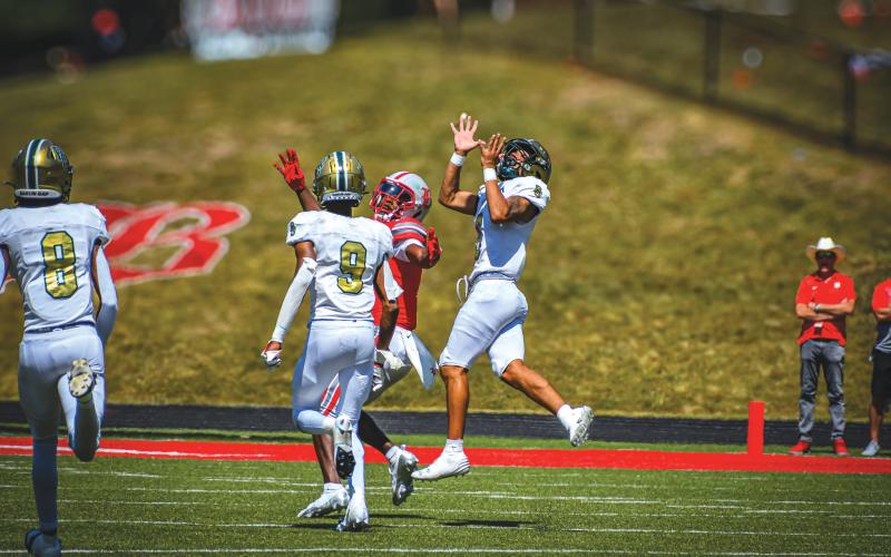 Wade Cheek/The Clayton Tribune. University of Cincinnati commit Patrick Williams elevates to break up a Baylor School pass. The Eagle defense allowed 274 yards of offense.