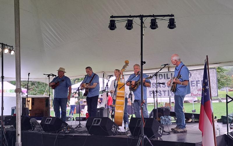 Megan Horn/The Clayton Tribune. Attendees at the 27th Dillard Bluegrass Benefit Festival Aug. 2 enjoyed toe-tapping to music by the bluegrass band Peachtree Station.