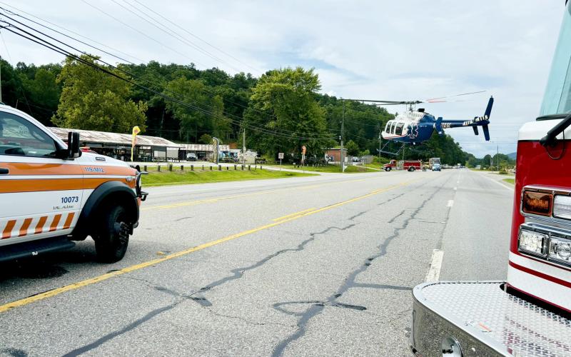 Photo from Rabun County EMS Facebook page. A helicopter lands in the roadway on Ga. 15 at its intersection with Market Circle in Rabun Gap Aug. 6 after a pedestrian was struck by a vehicle. The pedestrian was airlifted to Northeast Georgia Medical Center in Gainesville with suspected serious injuries.