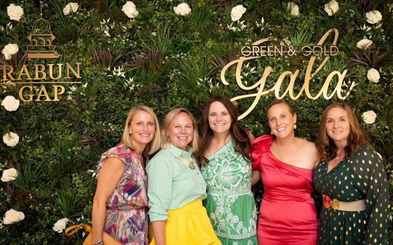 Submitted photo. Rabun Gap parents and volunteer gala committee members Meghann Brackett, Sarah Barge, Jennifer Stapleton, Bethany Weisser, Lisa Haynie at Rabun Gap-Nacoochee School’s Green &amp; Gold Gala.
