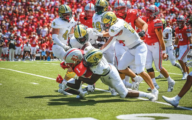 Wade Cheek/The Clayton Tribune. Multiple Rabun Gap defenders join in on a backfield tackle of Ole Miss running back commit Shekai Mills-Knight during the Eagles’ 1 p.m. bout against Baylor School that was broadcast on ESPN on Sunday, Aug. 25.