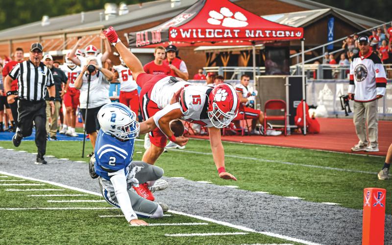 Wade Cheek/The Clayton Tribune. RCHS junior running back Reid Giles plows through a Fannin County’s Lawson Sullivan to fall close to the end zone during the Wildcats’ road game against the Rebels on Friday, Aug. 23.
