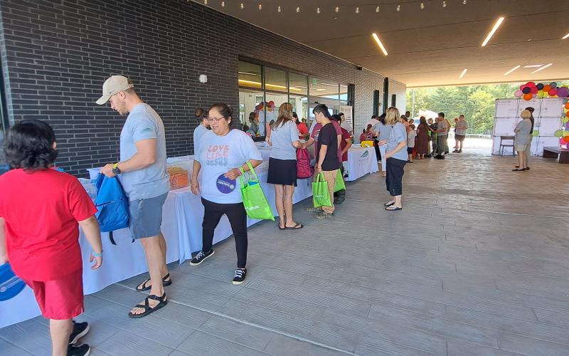 Megan Horn/The Clayton Tribune. Kids gather school supplies at Mountain Lakes Medical Center’s Back-To-School event on Saturday, Aug. 3. The event brought together many people in the community with resources.