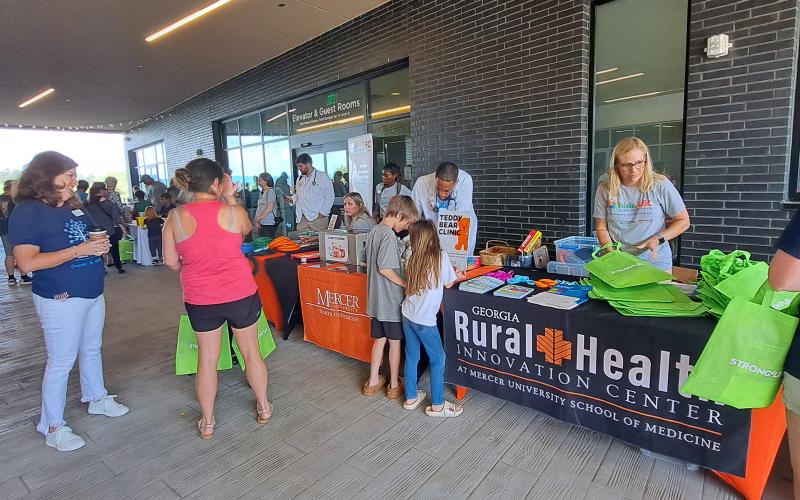 Megan Horn/The Clayton Tribune. Kids gather school supplies at Mountain Lakes Medical Center’s Back-To-School event on Saturday, Aug. 3. The event brought together many people in the community with resources.
