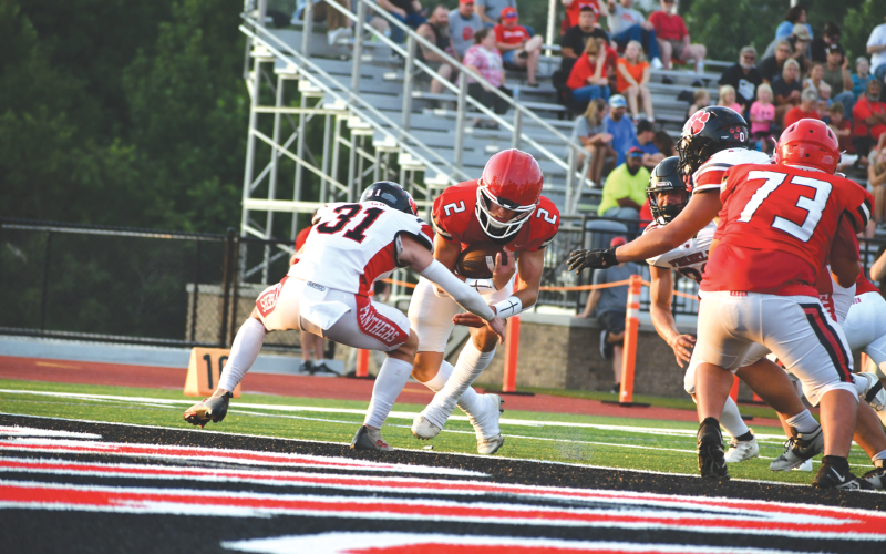 Wade Cheek/The Clayton Tribune. Rabun County junior quarterback Ty Truelove crosses the end zone line for the winning Wildcats during the Aug. 9 jamboree at Frank Snyder Memorial Stadium against visiting Franklin (N.C.) High School. The Wildcats will visit White County on Aug. 16 to start the regular season.