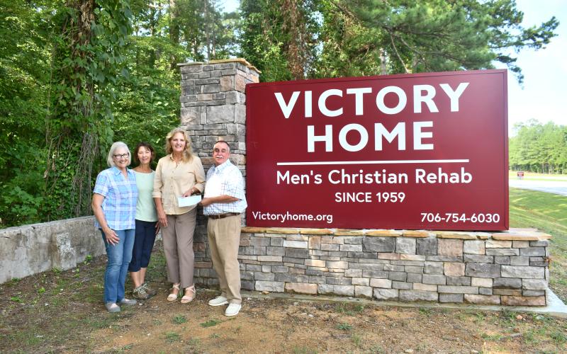 Megan Horn/The Clayton Tribune. Victory Home, a nonprofit in Tallulah Falls, recently received a donation from the Lake Burton Civic Association (LBCA) Foundation to purchase four AEDs for the facility. Pictured are Kathy Booker; Dr. Laura West; LBCA Foundation Chair Robin Gunn-Parker; and Mark Beach, executive director of Victory Home, Inc. Victory Home staff will be trained on how to use the AEDs as well as on Hands Only CPR.