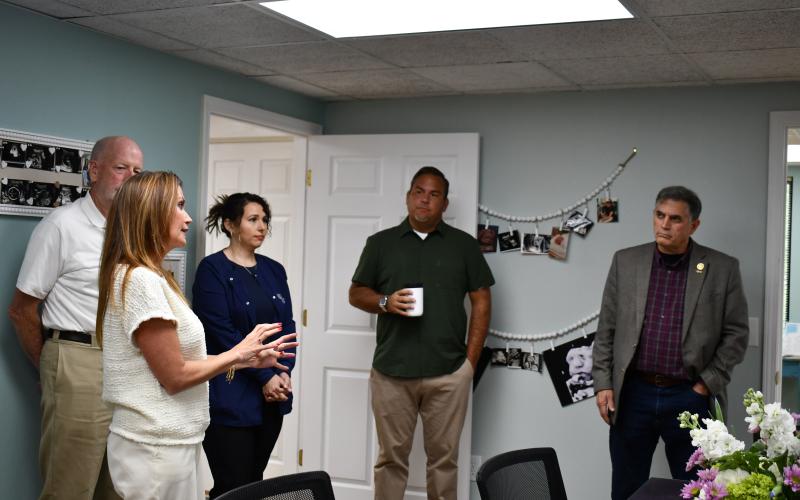 Megan Horn/The Clayton Tribune. Carla Wright, executive director of Choices Pregnancy Center, talks to U.S. Congressman Andrew Clyde, who serves the Georgia’s Ninth District, as well as other volunteers and community supporters about the nonprofit.