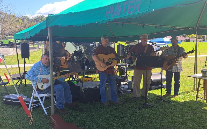 Megan Horn/The Clayton Tribune. Carlton York and Friends performs live music for event-goers at the third annual Tiger Corn Festival Sept. 21.