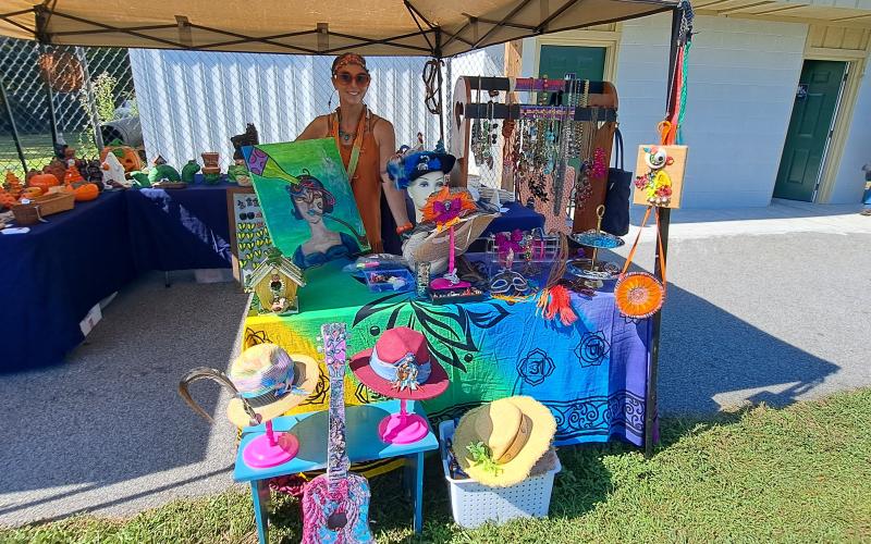 Megan Horn/The Clayton Tribune. Lisa Crescenzo displays her colorful creations at the Tiger Corn Festival on Saturday, Sept. 21.