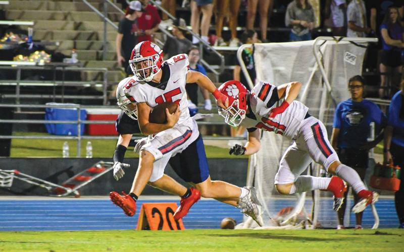 Wade Cheek/The Clayton Tribune. RCHS junior running back Reid Giles breaks a sideline tackle during a run against Banks County on Friday, Sept. 20. Giles rushed for two touchdowns in Rabun County’s 31-9 win over the Leopards.
