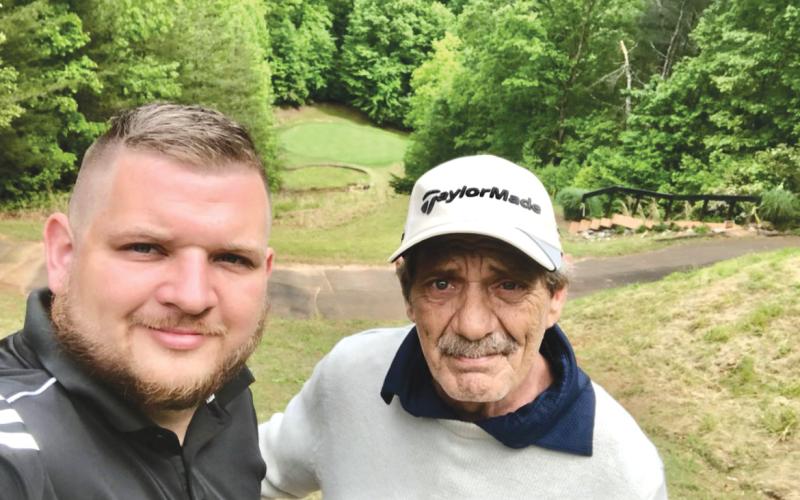 Submitted. Rabun County local Justin Ott stands with father Mel Ott after he sank a hole-in-one at Apple Mountain Resort and Golf Club last Sunday, Sept. 15.