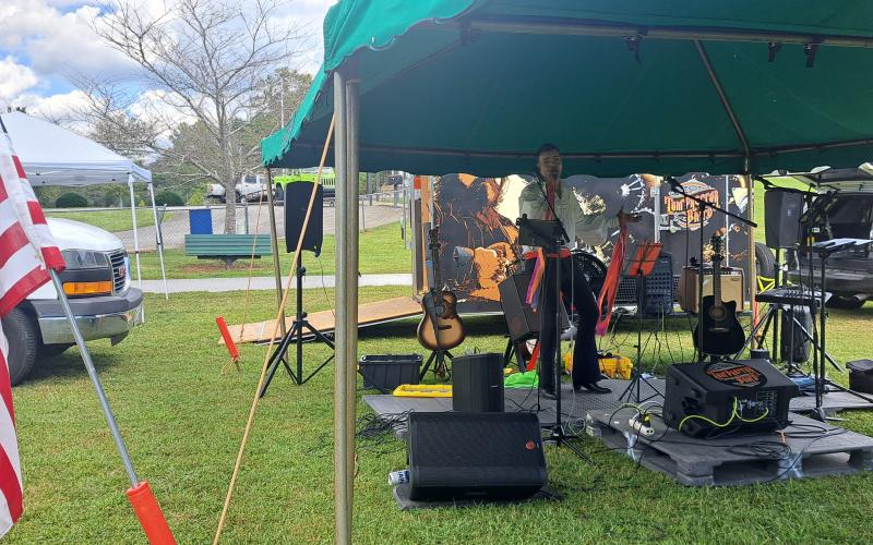 Megan Horn/The Clayton Tribune. Ishmael Santos sings as the Rabun Entertainers perform at the Tiger Corn Festival on Sept. 21.